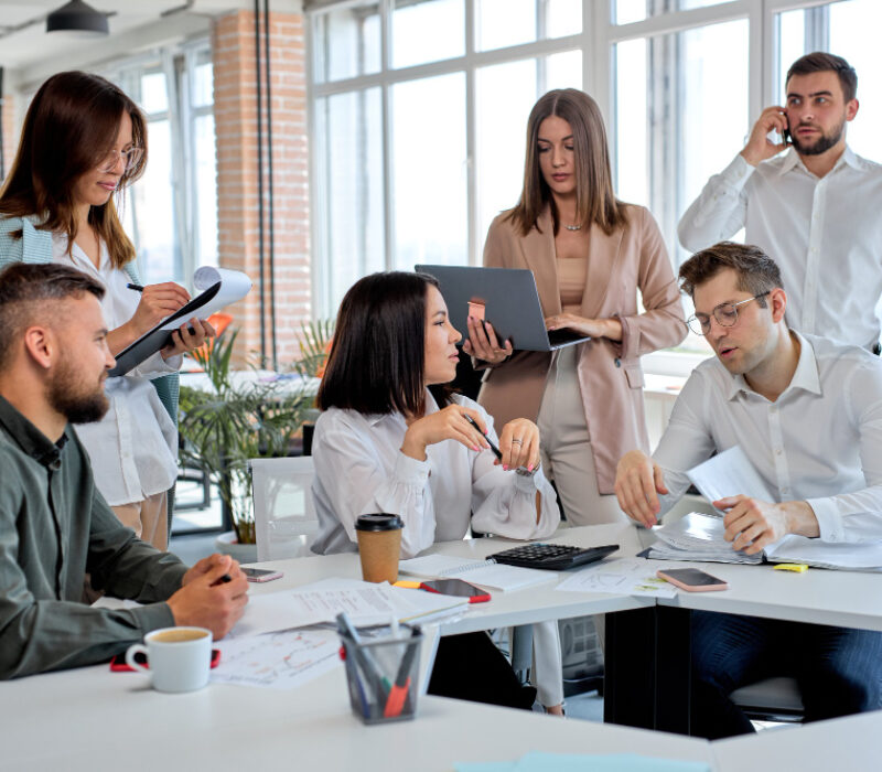 business-people-working-as-team-modern-office-discussing-business-plans-strategies-share-ideas-caucasian-men-women-formal-wear-having-talk-communicating-while-sitting-table