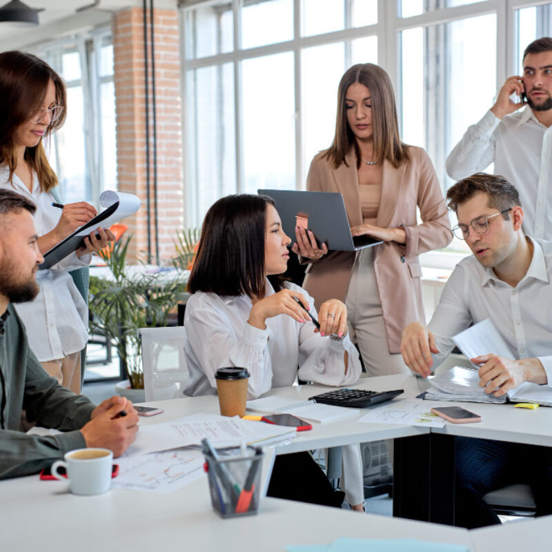 business-people-working-as-team-modern-office-discussing-business-plans-strategies-share-ideas-caucasian-men-women-formal-wear-having-talk-communicating-while-sitting-table